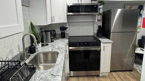 Coffee/tea maker, fridge, microwave, oven