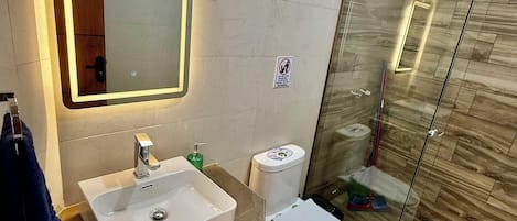 Shower, hair dryer, towels, soap