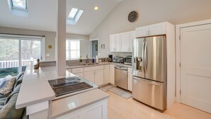 A modern kitchen with a large island, stainless steel appliances, and a skylight. - 6 Mi to Tanglewood! High-End Lee Apartment (Lee)