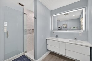 Shower, hair dryer, towels, toilet paper