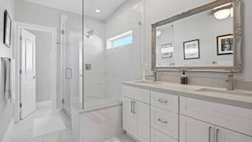 Shower, hair dryer, towels, shampoo