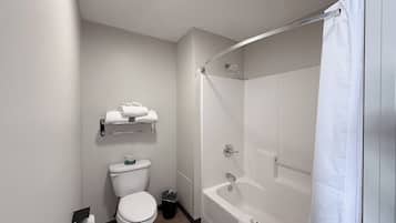 Desk, laptop workspace, blackout drapes, iron/ironing board