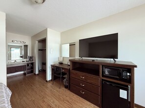 Desk, laptop workspace, blackout curtains, iron/ironing board