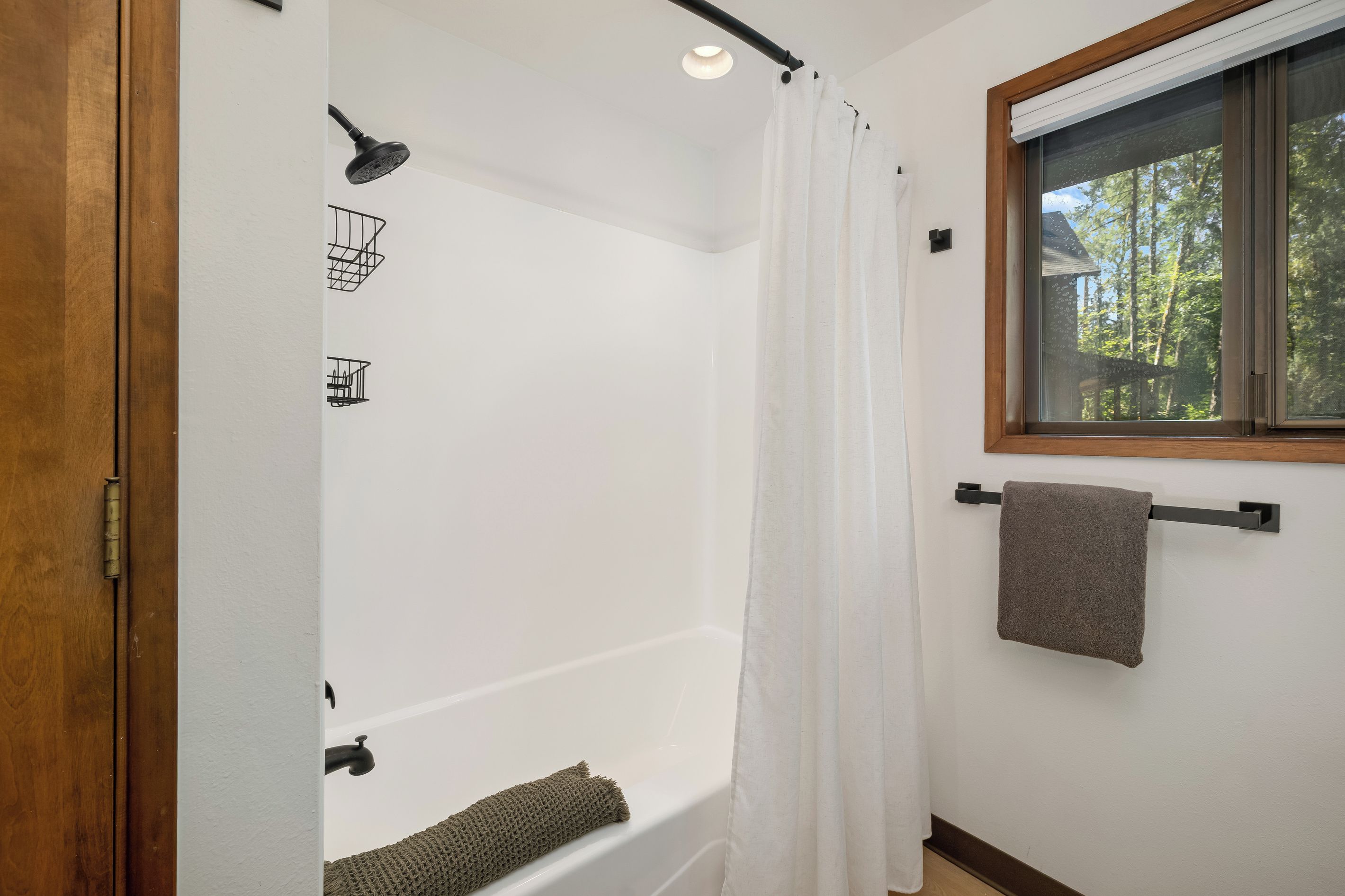 Soak away the day with treetop views right from the tub.