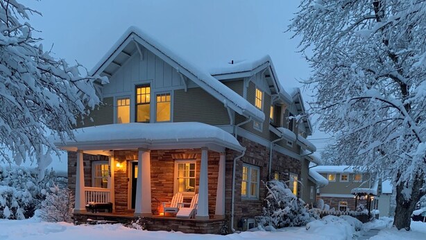 A two-story house with a porch and a covered entryway, surrounded by snow. - Your Perfect CU Graduation Headquarters: Walk to Folsom & Pearl St!
New Listing! (Boulder)