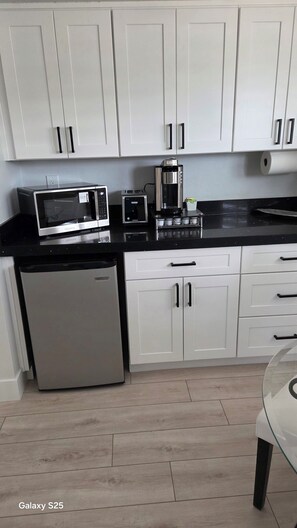 Fridge, microwave, coffee/tea maker, toaster