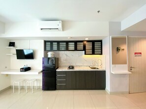 Private kitchen - Well Furnished And Cozy Stay Studio Grand Kamala Lagoon Apartment (Bekasi)