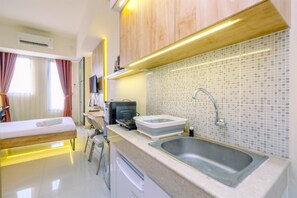 Standard Studio | Private kitchen - Comfy And Minimalist Studio Evenciio Margonda Apartment (Depok)