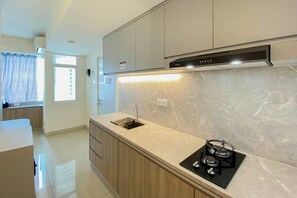 Private kitchen - Comfort And Homey Studio Grand Kamala Lagoon Apartment (Bekasi)