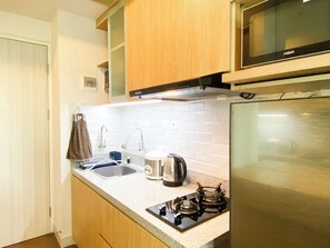 Private kitchen - Good Deal And Homey Studio Grand Kamala Lagoon Apartment (Bekasi)