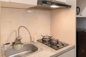 Standard Apartment | Private kitchen - Cozy And Good Living 1Br At Grand Kamala Lagoon Apartment (Bekasi)