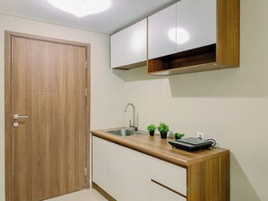 Standard Studio | Private kitchen | Electric kettle - Cozy Studio Apartment Royal Sentul Park (Bogor)