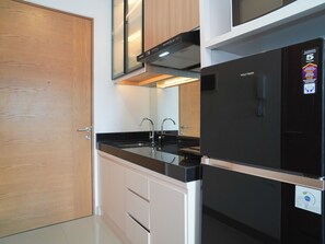 Standard Studio | Private kitchen - Chic And Comfortable Studio At Apartment Ciputra World 2 (Jakarta)