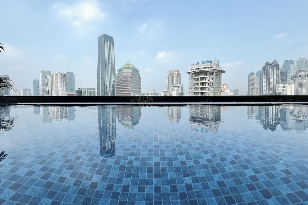 Modern Brown Toned Studio At Ciputra World 2 Apartment