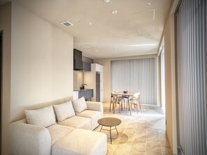 Junior Suite, Balcony, Ocean View | Living area | 55-inch flat-screen TV with digital channels - KANDOR RESORT OKINAWA (Nakijin)