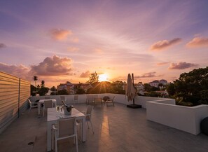 Outdoor dining - Romantic Island Retreat | Resort Pool & Sunset Rooftop (Battaleys)