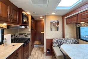 Fridge, microwave, oven, stovetop - The Benz - Luxury Motorhome (Stettler)