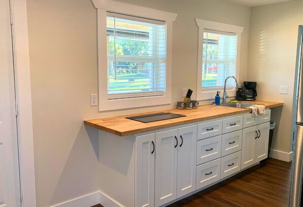 Fridge, microwave, stovetop, coffee/tea maker