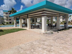 Outdoor dining - 2-bedroom condo in beautiful Punta Cana with AC for relaxing stays (Punta Cana)