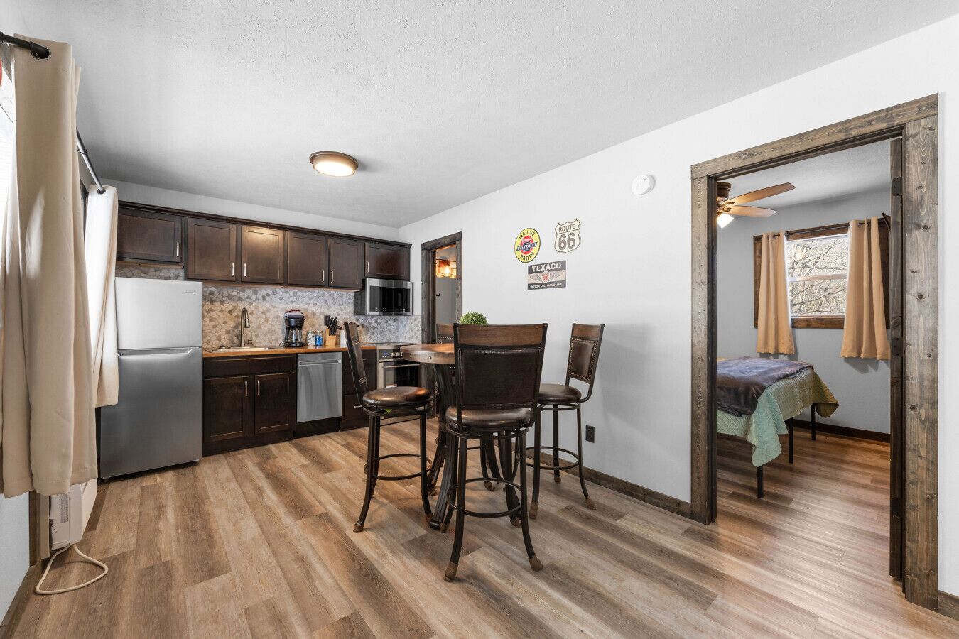 Microwave, stovetop, cookware/dishes/utensils, dining tables