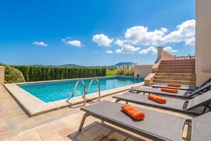 A swimming pool with lounge chairs and a staircase leading to an upper level. - SORT NOVA - Beautiful villa with private pool and free Wifi (Montuïri)