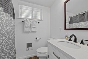 Shower, towels, soap, toilet paper