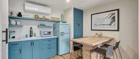 Fridge, coffee/tea maker, toaster, cookware/dishes/utensils