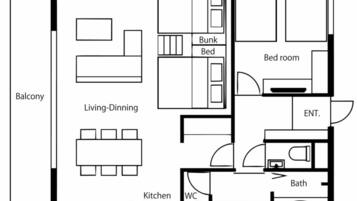 A floor plan with a balcony, living-dining area, bunk bed, bed room, bathroom, kitchen, WC, and an entrance.