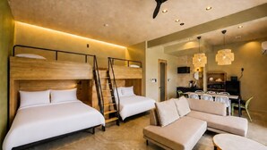 A modern hotel room with two beds, a sofa, a dining table, and a ceiling fan. - Yanbaru Pool Condo Yagaji by COLDIO (Nago)