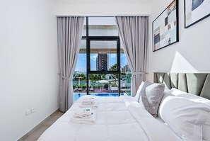 Apartment, Balcony, Pool View | Iron/ironing board, free WiFi - Bloomfields Cozy 1BR Azizi Riveria 47 (Dubai)
