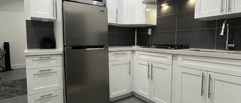 Fridge, microwave, stovetop, coffee/tea maker