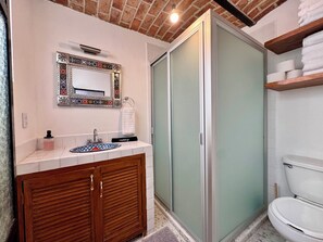 Shower, hair dryer, towels, soap