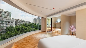 A modern hotel room with a large window, a bed, a desk, and a chair. - PIN Hotel Guangzhou Beijing Road Pedestrian Street Peasant Movement Institute Metro Station Branch (Guangzhou)