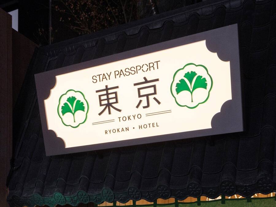 A sign for Stay Passport Tokyo Ryokan Hotel.