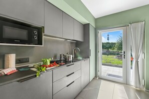 Family Apartment, Multiple Bedrooms (Villa Al Fiume - Oasi Verde) | Private kitchen - Villa al Fiume (Nago-Torbole)