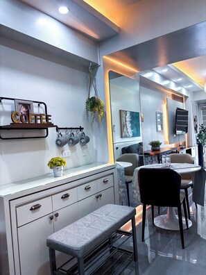 Shared Dormitory, 1 Bedroom, Balcony | Dining - Room-elegant One-bedroom Retreat With Co (Iloilo)
