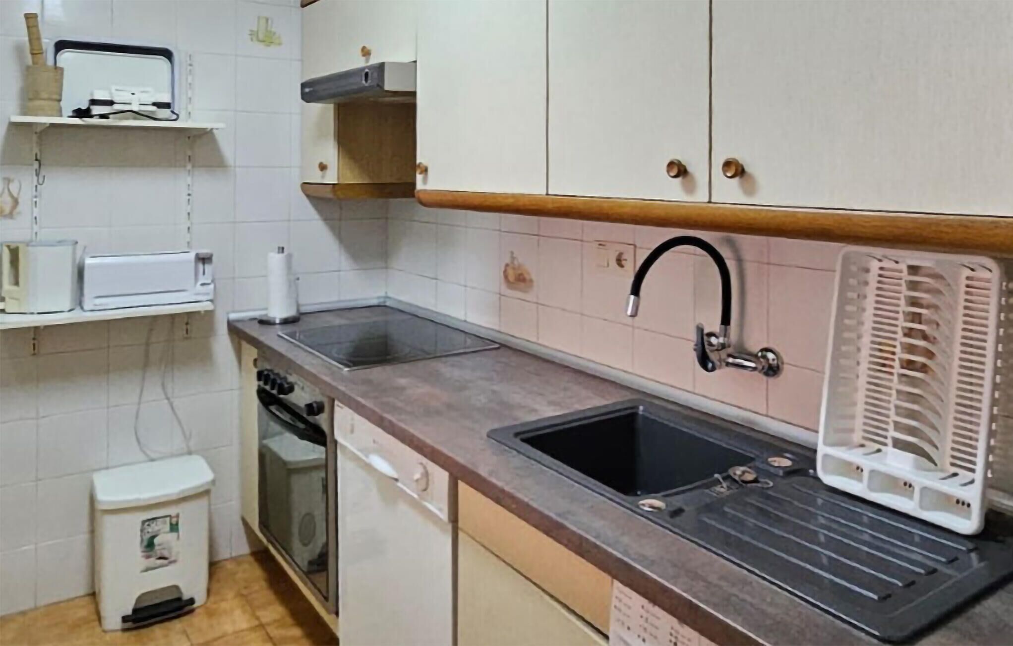 Fridge, stovetop, dishwasher, coffee/tea maker