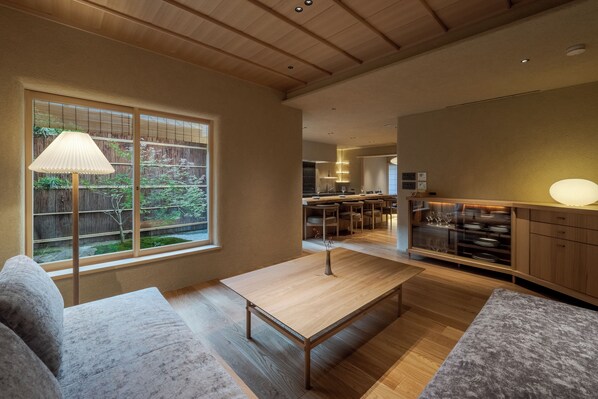 Maison mitoyenne, vue jardin | Coin séjour