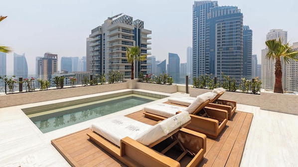 Outdoor pool, pool loungers - Ultimate Luxury Penthouse w/ Pool & Marina Views (Dubai)