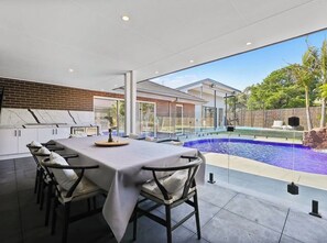 Outdoor dining - Resort-style family retreat with pool, gym & basketball (Craigieburn)