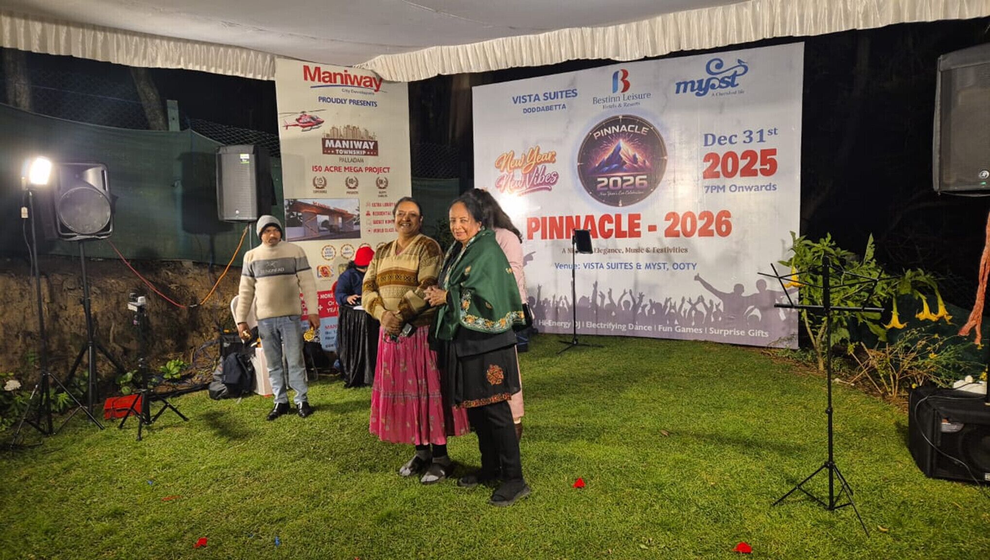 A promotional event with banners for Manipay Township and Pinnacle 2026.