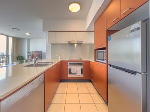 Fridge, microwave, oven, stovetop - Chevron Riverview Apartment, Surfers Paradise (Surfers Paradise)
