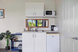 Microwave, electric kettle, toaster, cookware/dishes/utensils