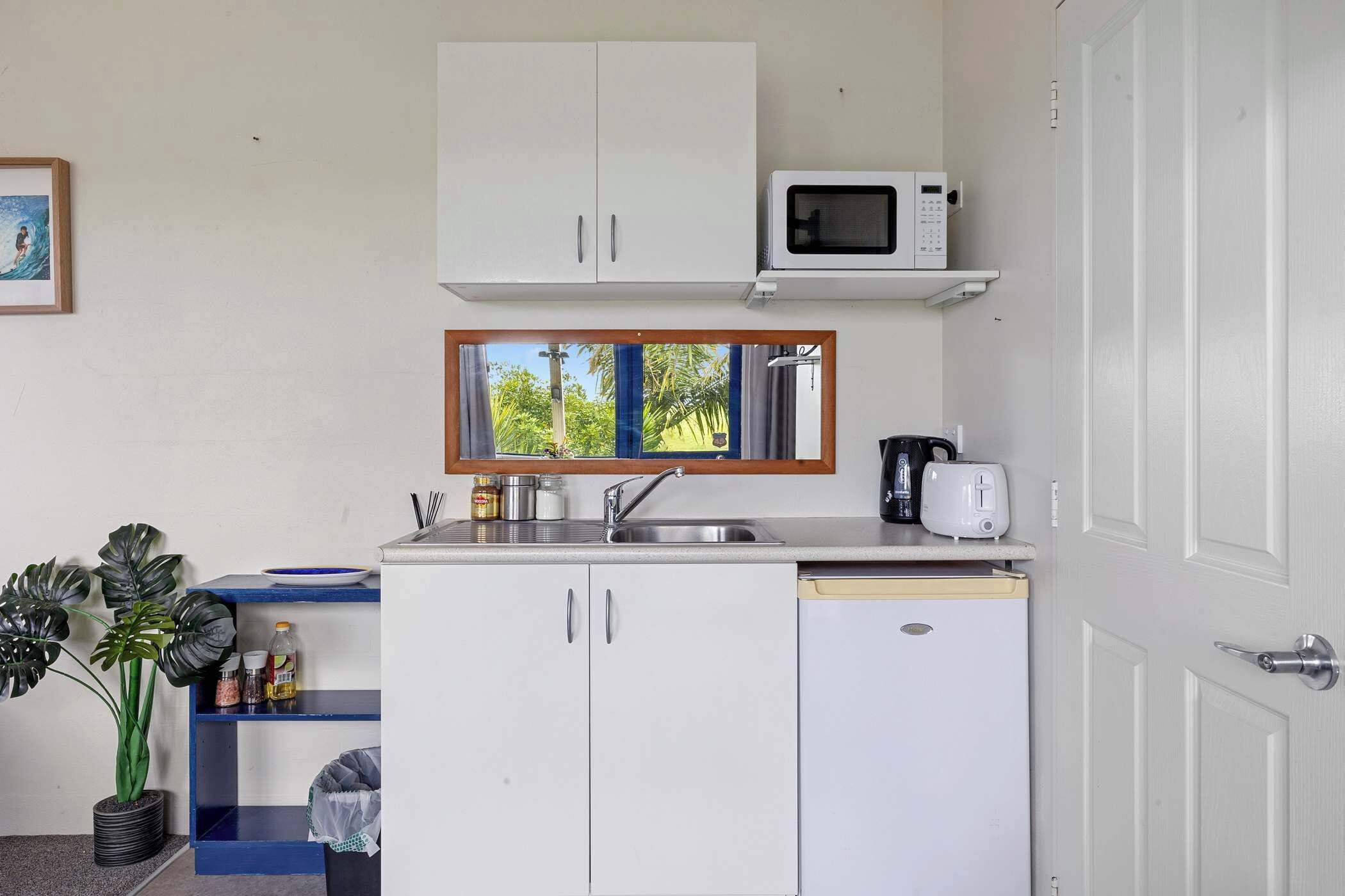 Microwave, stovetop, toaster, cookware/dishes/utensils