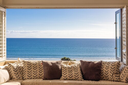Premium 3BR beachside apartment, sea views, open living, 100 metres from beach