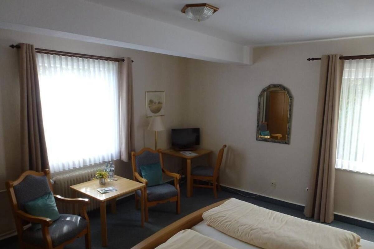 Basic Double Room, Balcony, Garden View | Laptop workspace, free cots/infant beds, free WiFi, bed sheets