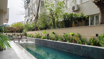 Seasonal outdoor pool, pool umbrellas, sun loungers