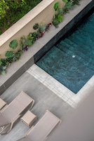 Seasonal outdoor pool, pool umbrellas, pool loungers