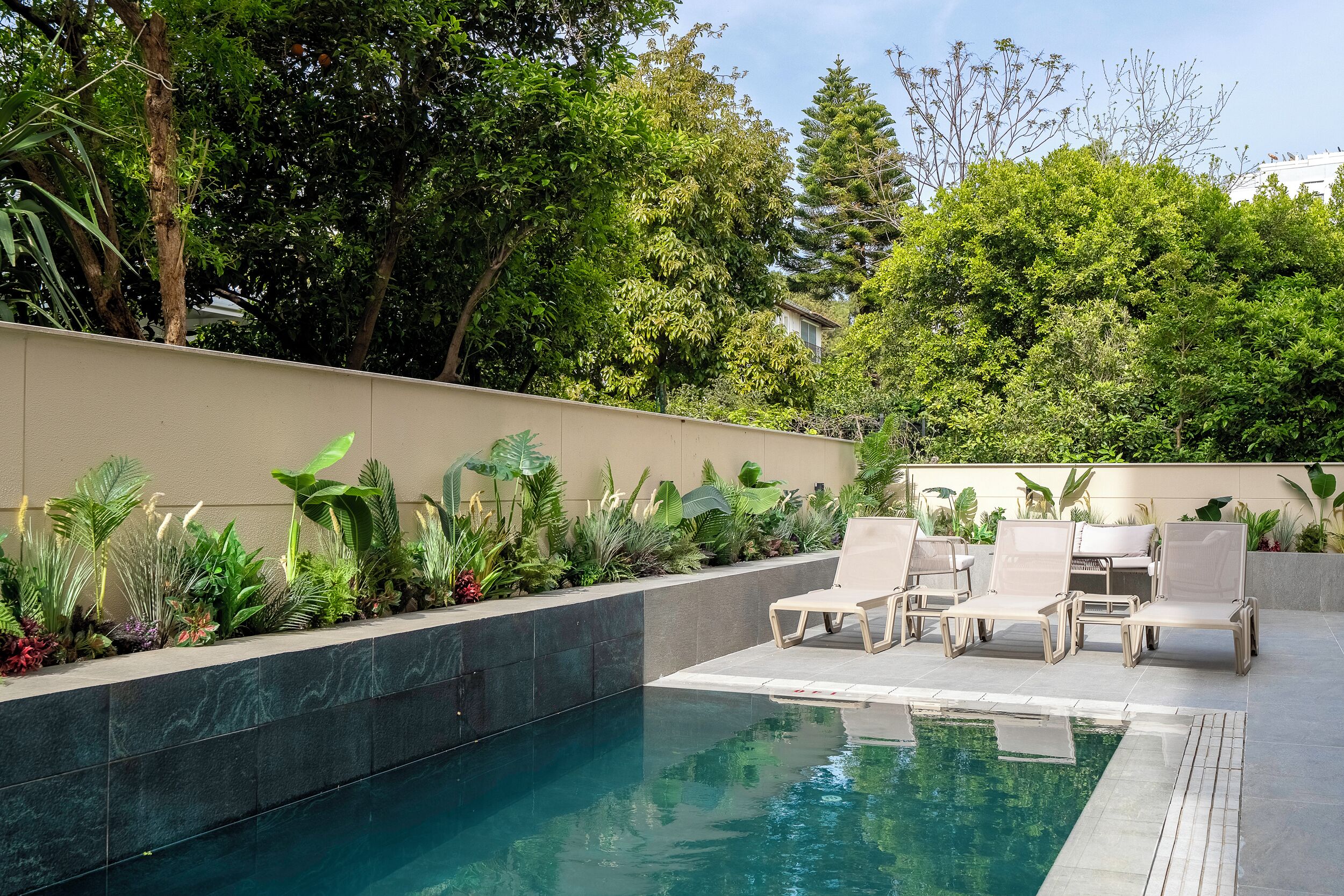 Seasonal outdoor pool, pool umbrellas, pool loungers