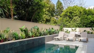 Seasonal outdoor pool, pool umbrellas, pool loungers